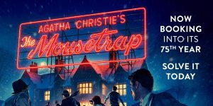 A dark scene with a house with lights on can be seen in the background, A large red neon sign sits on top of the house reading 'Agatha Christie's The Mousetrap' at the bottom of the image people can be seen looking towards the house.