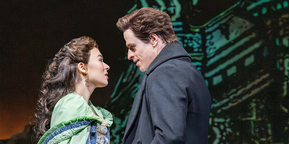 Anna Zavelson as Christine and Ashley Gilmour as Raoul, performing in a dramatic scene from Phantom Of The Opera.