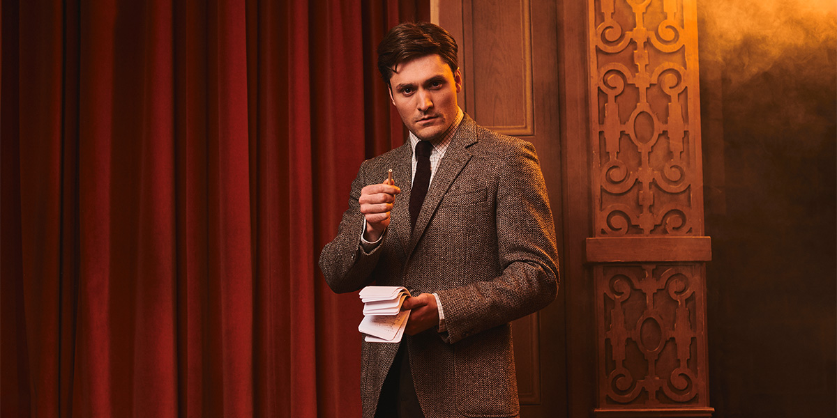 A scene from "The Mousetrap" featuring actors in period costumes on stage, with dramatic lighting.