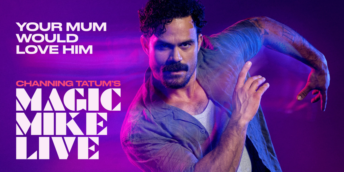 A dynamic performance scene from Magic Mike Live, featuring dancers in vibrant costumes and dramatic lighting.