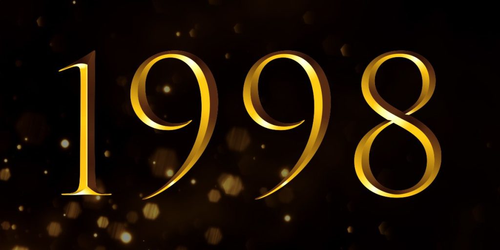 Gold numbers "1998" on a black background with a subtle bokeh effect, representing the Olivier Winners.