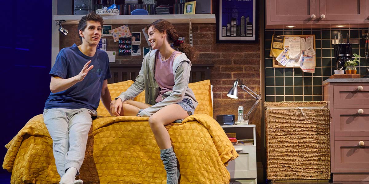 Keelan McAuley and Stevie Doc in costume, performing on stage with vibrant lighting and dramatic expressions.