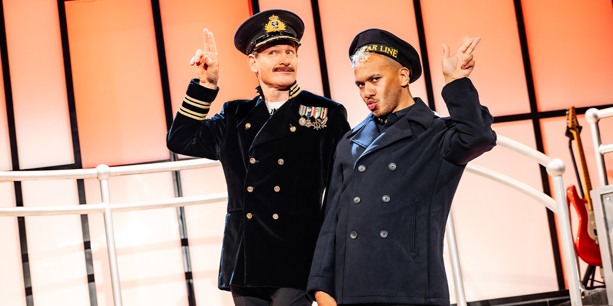 A close-up of a detailed, ornate ship model with intricate textures, set against a dark background.