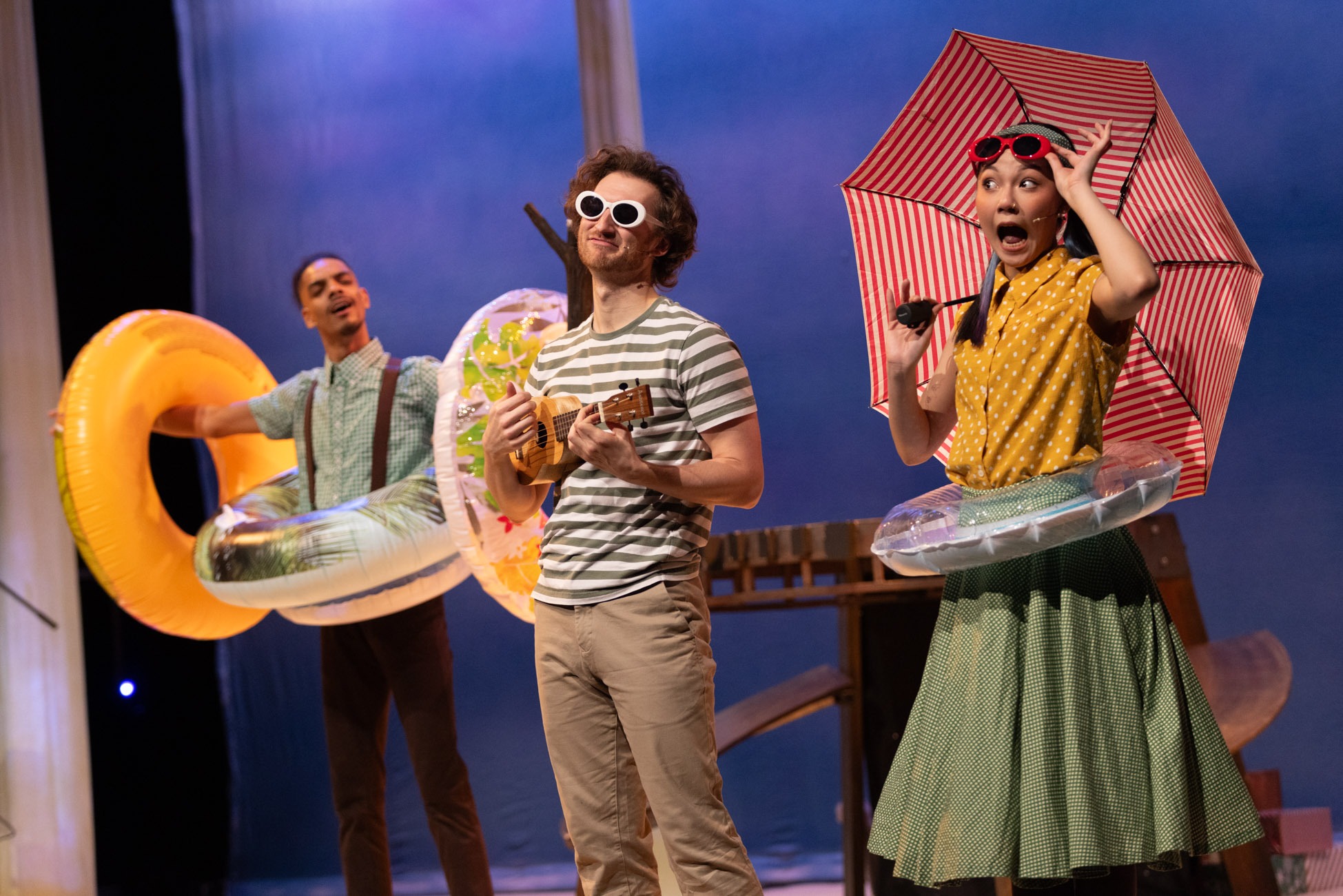 A stick figure with a smiling face stands on a textured surface, surrounded by colourful abstract shapes.