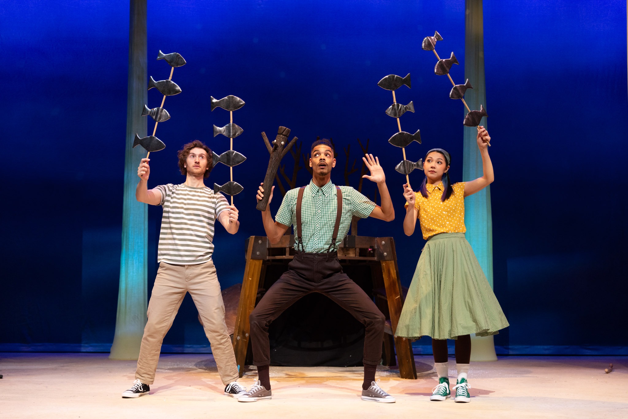 A stick figure stands upright, arms outstretched, against a plain white background.