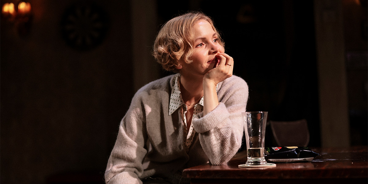 Kate Phillips and Valerie stand together, both smiling, against a softly lit, neutral background.