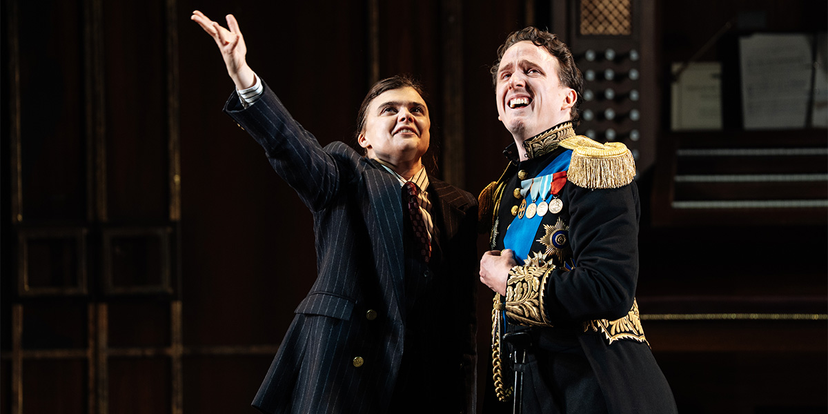 A scene from Twelfth Night featuring actors in period costumes on stage, with vibrant set designs and lighting.