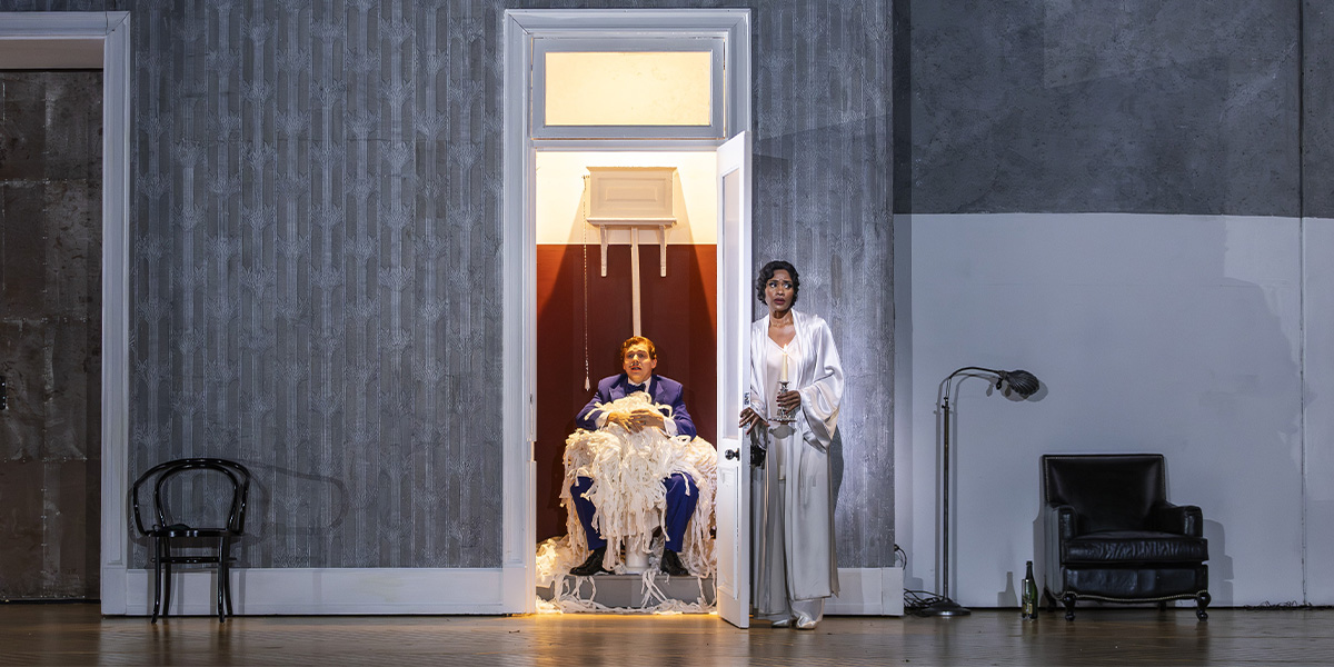 Hugh Cutting and Nardus Williams perform in ENO's Partenope 2025, wearing elaborate costumes on stage.