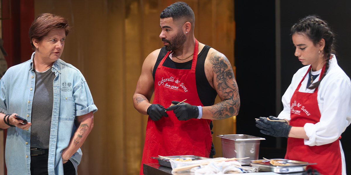 Jackie Clune as Paula, Ash Hunter as Billy, and Mithra Malek as T pose together on stage.