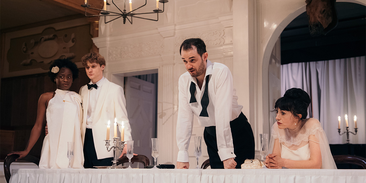 A scene from "A Midsummer Night's Dream" featuring actors in vibrant costumes performing on a stage.