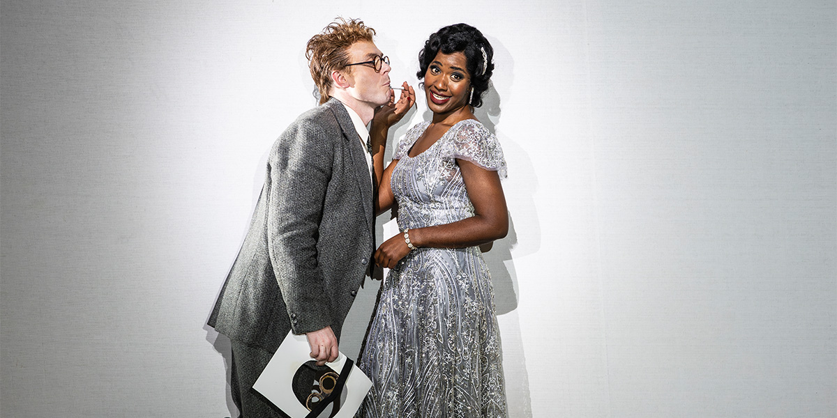 Ru Charlesworth and Nardus Williams perform in ENO's Partenope 2025, wearing elaborate costumes on stage.