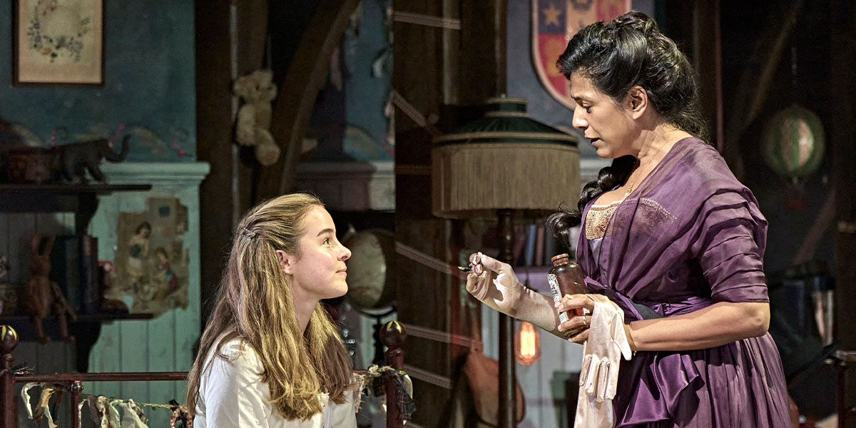 Wendy and Peter Pan are flying together, surrounded by a starry night sky with soft clouds.