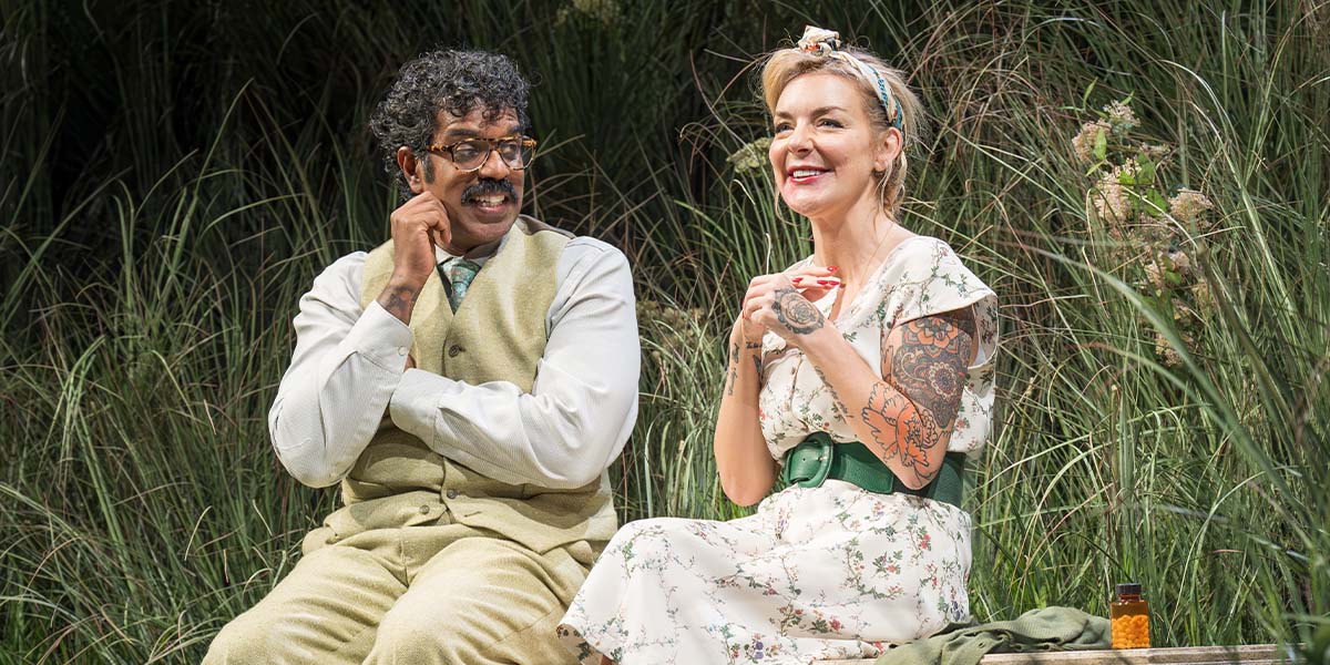 Romesh Ranganathan as Bill and Sheridan Smith as Susan, both seated, with a neutral background.