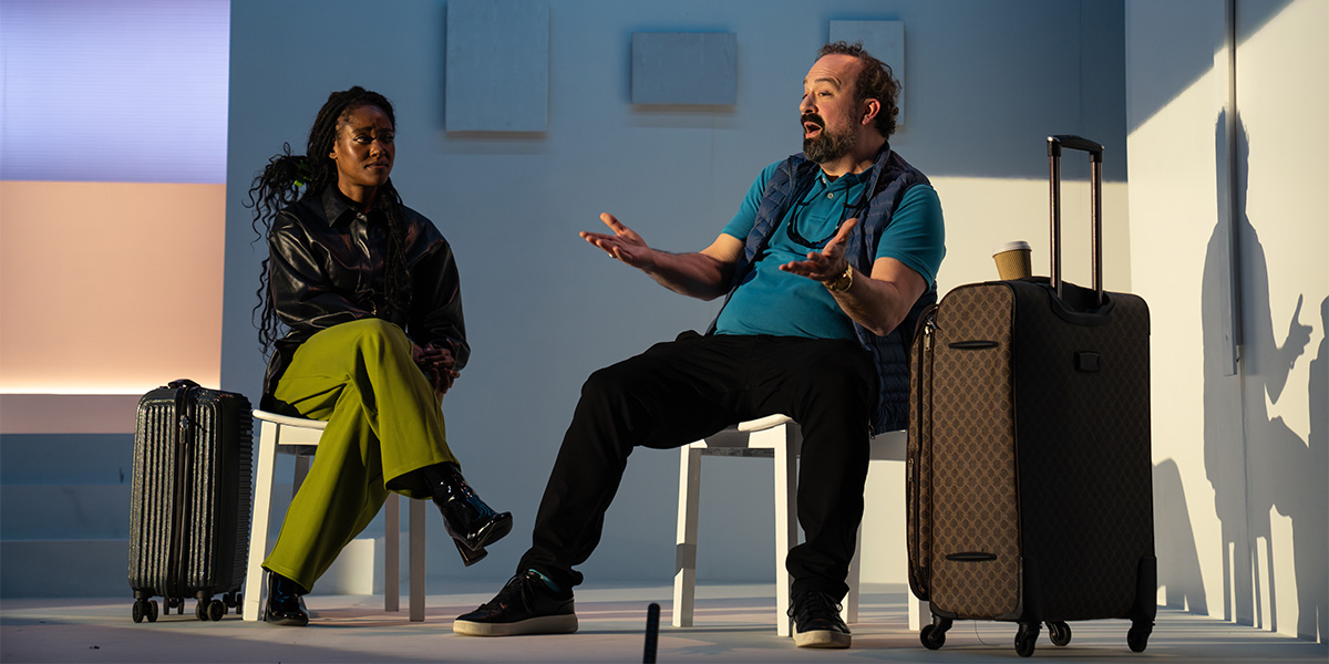 Arsema Thomas and Steve Zissis pose together, both wearing casual clothing against a soft, neutral background.