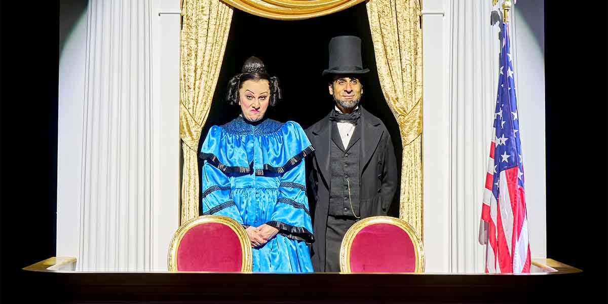 Jinkx Monsoon as Mary Todd Lincoln and Scott Karim as Mary's husband, posed in a theatre box.