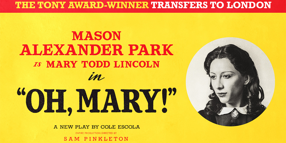 A woman in a flowing white dress stands on a beach, gazing thoughtfully at the ocean waves.