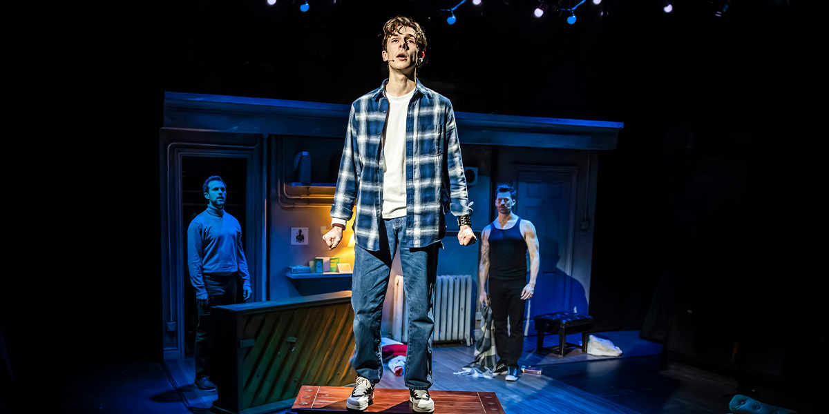Iffy Mizrahi, Killian Thomas Lefevre, and Levi Kreis pose together, smiling against a neutral backdrop.