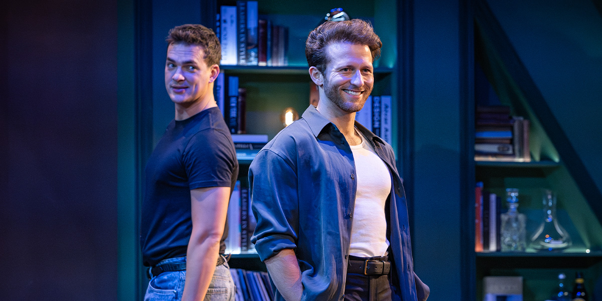 Two people stand side-by-side.