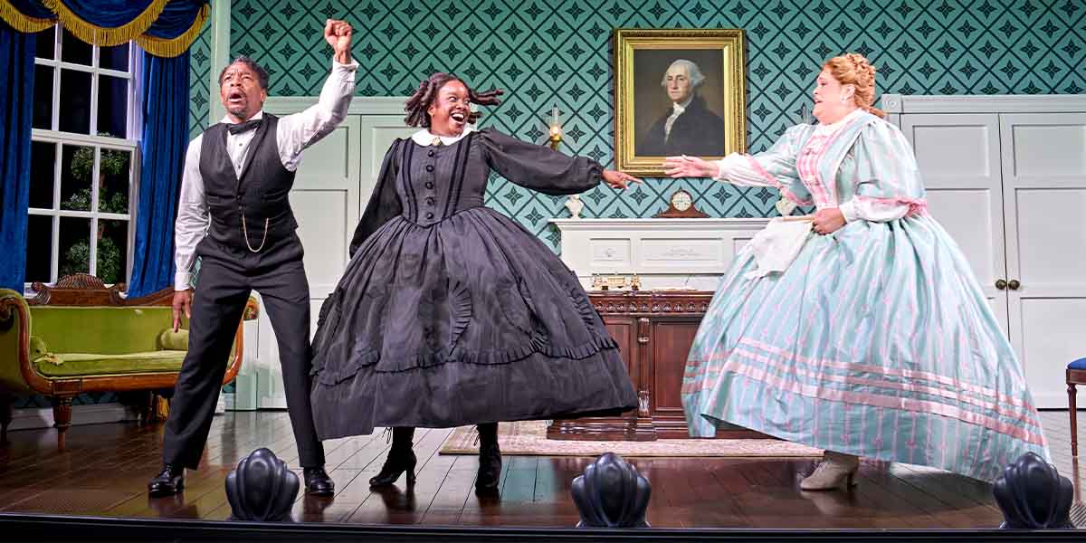 Syrus Lowe, Lolly Adefope as Mary Todd Lincoln, and Lucy Frederick pose together, smiling.