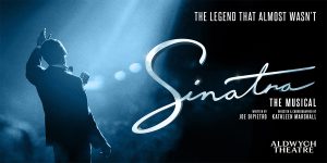 A scene from "Sinatra: The Musical" featuring performers in elegant costumes, with a spotlight illuminating the stage.