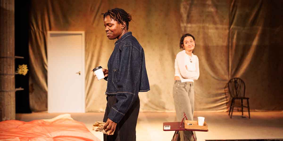 Francesca Amewudah-Rivers and Nadi Kemp-Sayfi perform in ‘Tender’ at Bush Theatre, with a simple set.