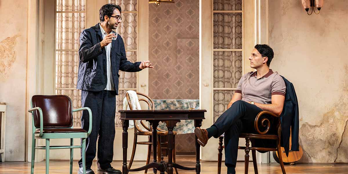 Shubham Saraf and Noof Ousellam perform on stage in a scene from The Cherry Orchard.
