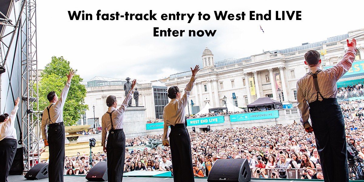 A vibrant stage with performers in colourful costumes, showcasing a lively musical number at West End Live.