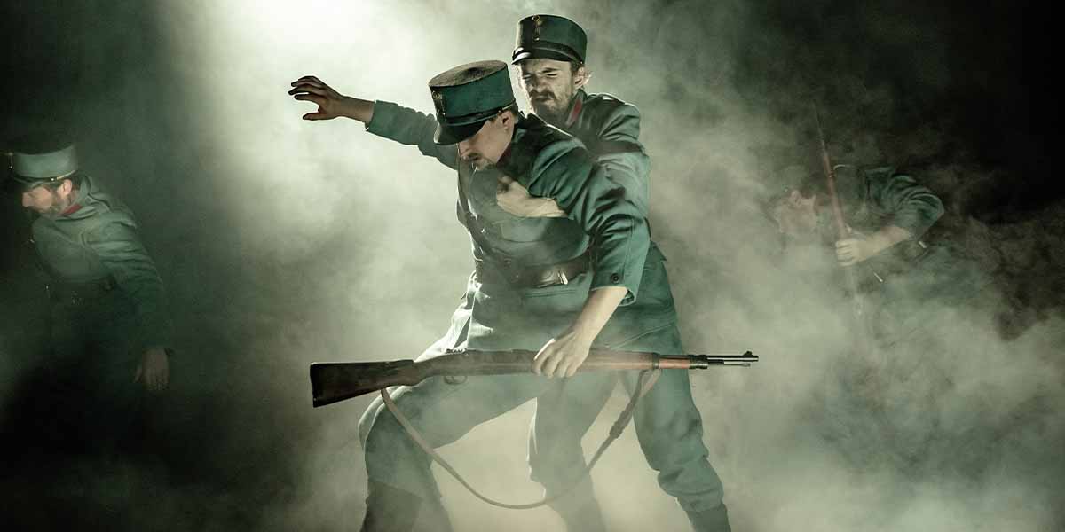 Two soldiers in green uniforms grapple in a smoky environment, one holding a rifle, dramatic lighting.