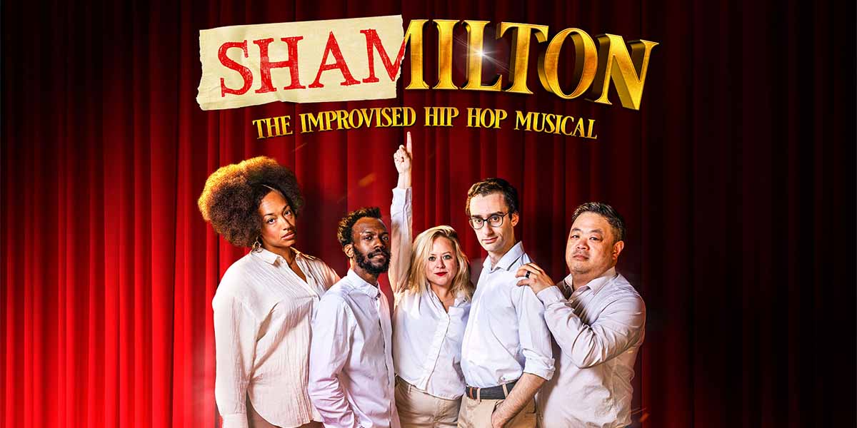 Five performers in white shirts pose confidently against a red curtain, with "SHAMILTON" prominently displayed above.